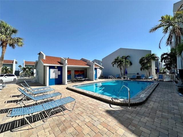 320 Medallion Blvd Unit G, Madeira Beach, FL 33708 - community pool with a patio and fence