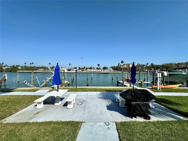 320 Medallion Blvd Unit G, Madeira Beach, FL 33708 - view of patio / terrace with a boat dock and a water view