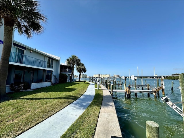 320 Medallion Blvd Unit G, Madeira Beach, FL 33708 - dock area with a lawn, a water view, and boat lift
