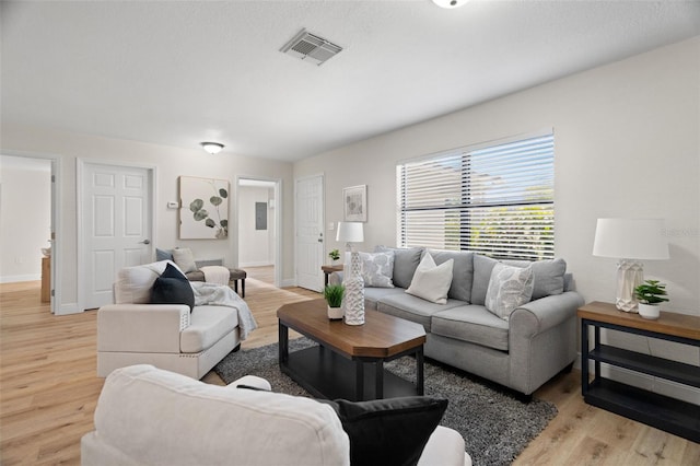 4549 Ontario Dr, New Port Richey, FL 34652 - living area with light wood-style floors and baseboards
