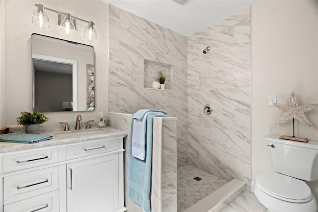 4549 Ontario Dr, New Port Richey, FL 34652 - bathroom with marble finish flooring, a tile shower, vanity, and toilet