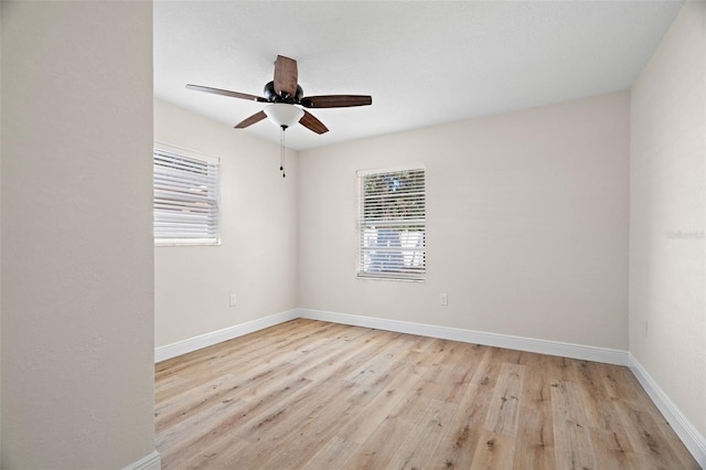 4549 Ontario Dr, New Port Richey, FL 34652 - unfurnished room featuring healthy amount of natural light, a ceiling fan, and baseboards