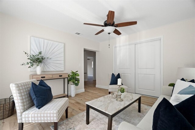 4549 Ontario Dr, New Port Richey, FL 34652 - living area with ceiling fan, light wood finished floors, and baseboards