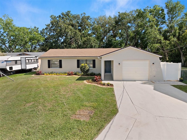 4549 Ontario Dr, New Port Richey, FL 34652 - ranch-style house featuring a garage, driveway, and stucco siding