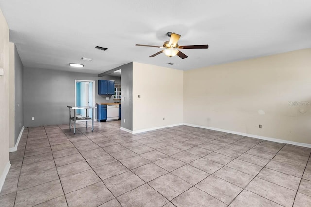 unfurnished room featuring a ceiling fan, light tile patterned flooring, and baseboards