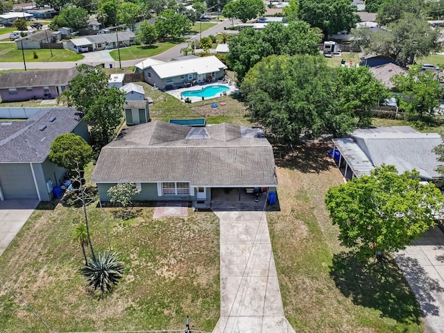 aerial view of residential area featuring a pool