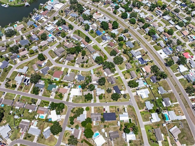aerial overview of property's location featuring a nearby body of water
