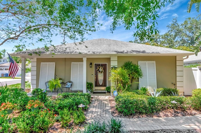 4125 W Obispo St, Tampa, FL 33629 - bungalow-style house featuring a porch, stucco siding, and roof with shingles