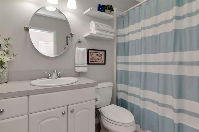 4125 W Obispo St, Tampa, FL 33629 - full bath featuring toilet, vanity, and a shower with shower curtain