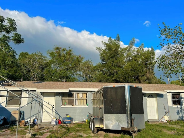 1104 E 122nd Ave, Tampa, FL 33612 - view of front of house featuring a shingled roof