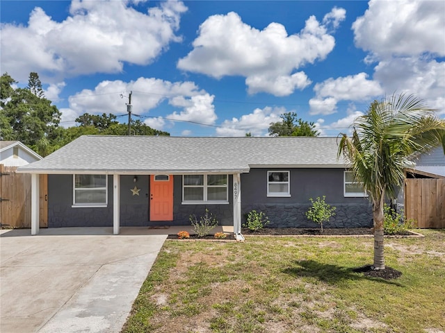 8497 Portulaca Ave, Seminole, FL 33777 - ranch-style house featuring roof with shingles, driveway, stucco siding, and stone siding