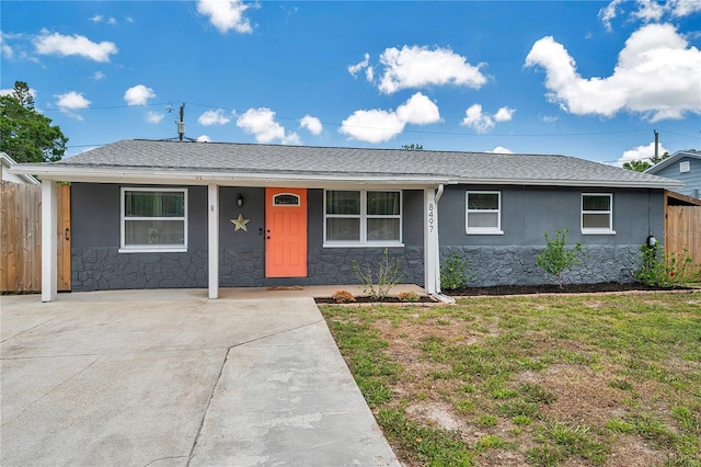 8497 Portulaca Ave, Seminole, FL 33777 - single story home with covered porch, stone siding, and stucco siding