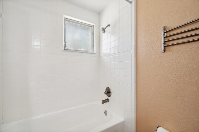 8497 Portulaca Ave, Seminole, FL 33777 - full bath with a textured wall and shower / bathtub combination