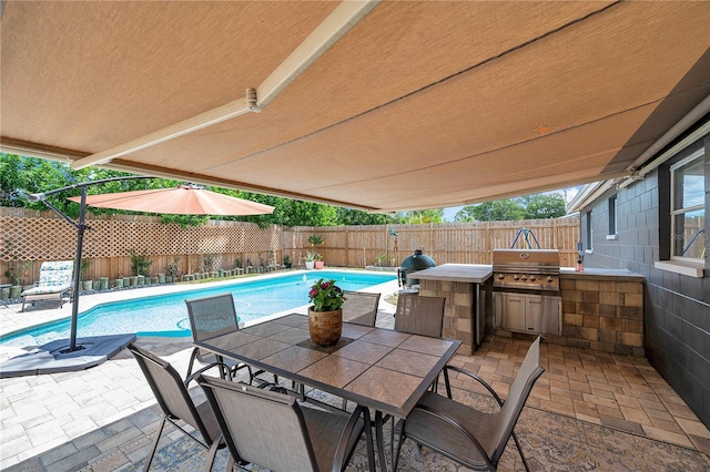 8497 Portulaca Ave, Seminole, FL 33777 - view of patio with grilling area, a fenced backyard, outdoor dining area, and area for grilling