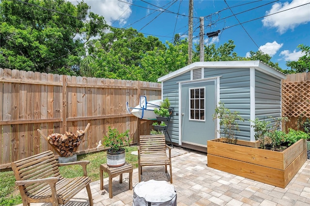 8497 Portulaca Ave, Seminole, FL 33777 - view of patio / terrace featuring fence, a shed, and an outbuilding