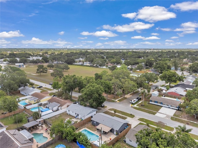 8497 Portulaca Ave, Seminole, FL 33777 - aerial perspective of suburban area featuring a pool