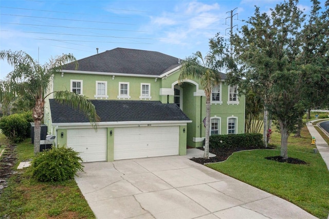 2832 Brinley Dr, New Port Richey, FL 34655 - view of front of house with stucco siding, concrete driveway, an attached garage, a front yard, and a shingled roof