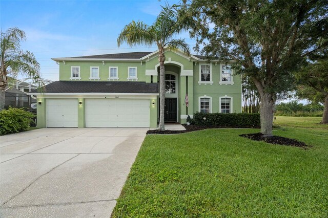 2832 Brinley Dr, New Port Richey, FL 34655 - traditional-style home featuring stucco siding, concrete driveway, a front yard, an attached garage, and a shingled roof