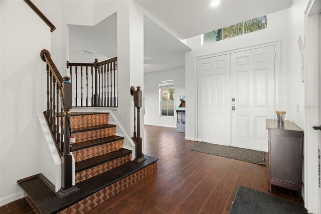 2832 Brinley Dr, New Port Richey, FL 34655 - entrance foyer featuring wood finished floors, stairway, and baseboards