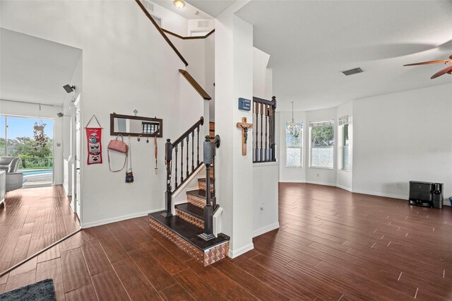 2832 Brinley Dr, New Port Richey, FL 34655 - entrance foyer with wood finished floors, healthy amount of natural light, and baseboards