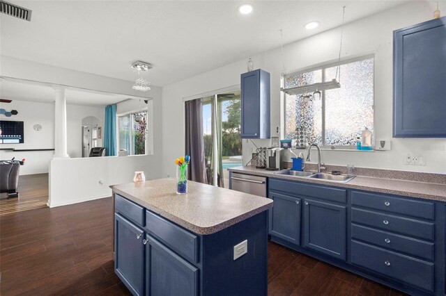 2832 Brinley Dr, New Port Richey, FL 34655 - kitchen featuring a sink, blue cabinetry, stainless steel dishwasher, dark wood-style floors, and recessed lighting