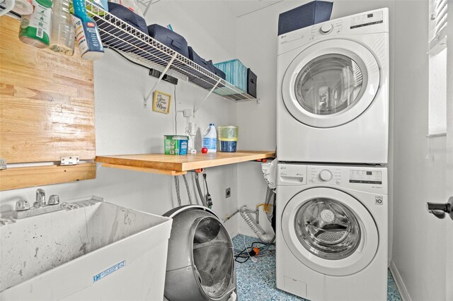 2832 Brinley Dr, New Port Richey, FL 34655 - washroom featuring stacked washer / drying machine and baseboards