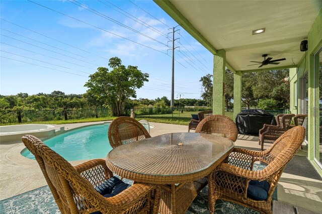 2832 Brinley Dr, New Port Richey, FL 34655 - view of patio / terrace featuring ceiling fan, area for grilling, and a pool with connected hot tub