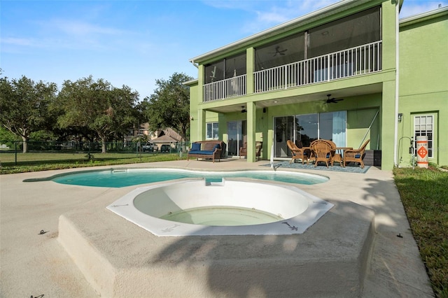2832 Brinley Dr, New Port Richey, FL 34655 - swimming pool featuring a ceiling fan, a patio area, and an outdoor hot tub