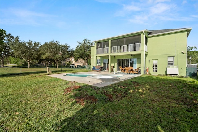 2832 Brinley Dr, New Port Richey, FL 34655 - rear view of property with a ceiling fan, stucco siding, a patio, an outdoor pool, and a sunroom