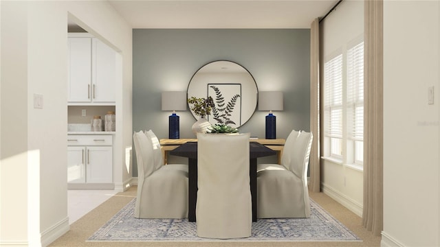 4511 S Manhattan Ave Unit 13, Tampa, FL 33611 - dining space featuring baseboards and light colored carpet