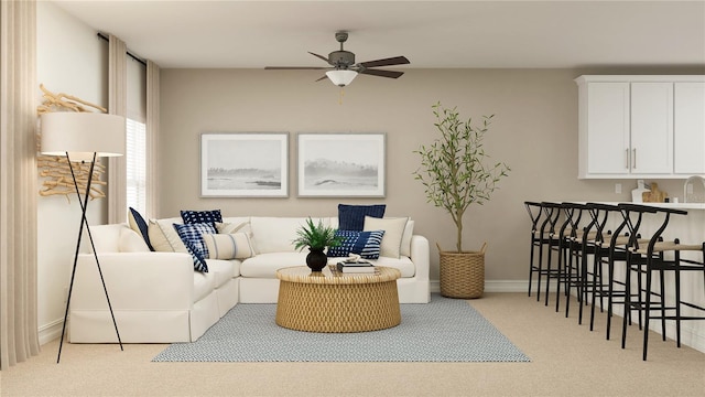 4511 S Manhattan Ave Unit 13, Tampa, FL 33611 - carpeted living area featuring ceiling fan and baseboards