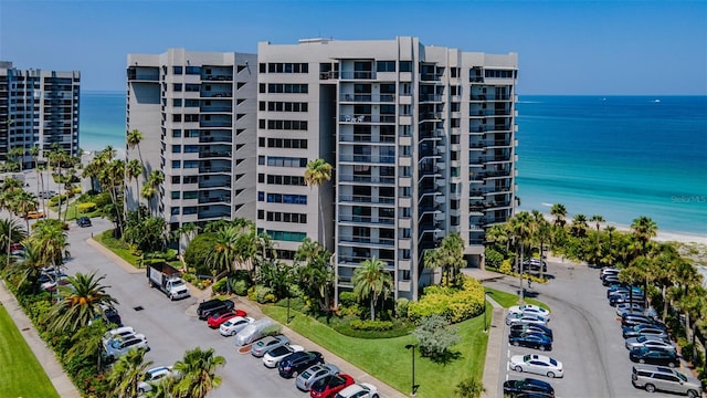 1600 Gulf Blvd Unit 514, Clearwater Beach, FL 33767 - view of apartment building / complex featuring uncovered parking and a water view