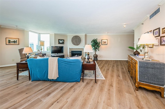 1600 Gulf Blvd Unit 514, Clearwater Beach, FL 33767 - living area featuring ornamental molding, light wood-style floors, baseboards, and a fireplace