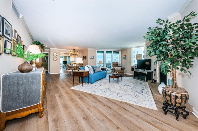 1600 Gulf Blvd Unit 514, Clearwater Beach, FL 33767 - living area featuring ornamental molding, wood finished floors, a chandelier, and baseboards