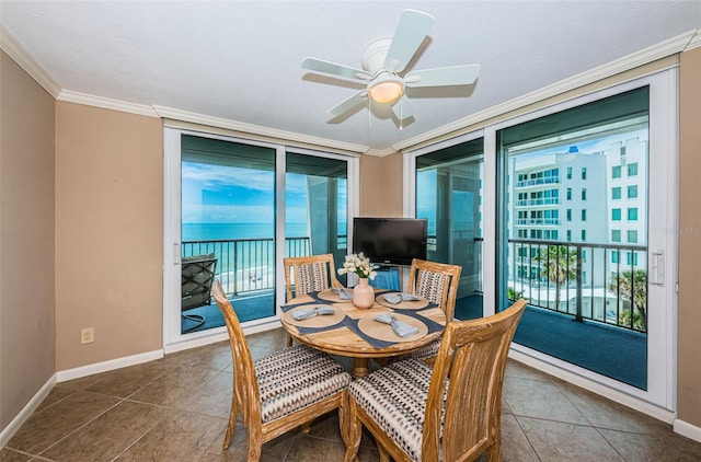 1600 Gulf Blvd Unit 514, Clearwater Beach, FL 33767 - tiled dining room featuring plenty of natural light, baseboards, crown molding, and ceiling fan