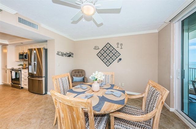 1600 Gulf Blvd Unit 514, Clearwater Beach, FL 33767 - dining space featuring crown molding, light tile patterned floors, a ceiling fan, and baseboards