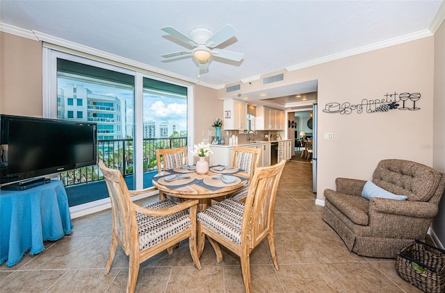 1600 Gulf Blvd Unit 514, Clearwater Beach, FL 33767 - dining room featuring ornamental molding, ceiling fan, light tile patterned floors, and baseboards