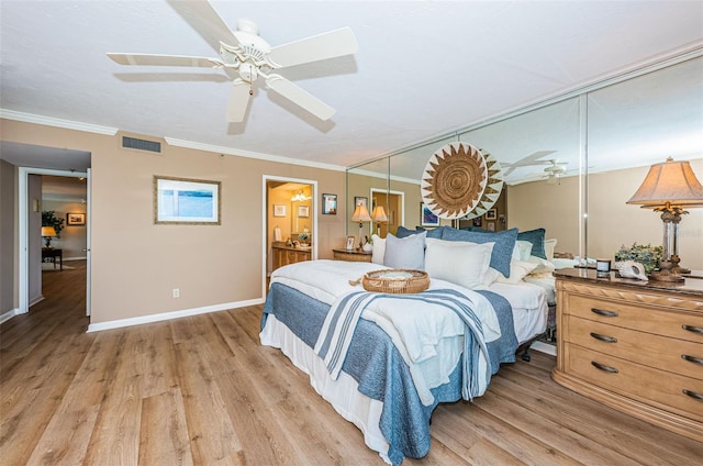 1600 Gulf Blvd Unit 514, Clearwater Beach, FL 33767 - bedroom featuring crown molding, light wood-style floors, baseboards, connected bathroom, and ceiling fan