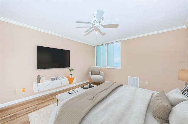 1600 Gulf Blvd Unit 514, Clearwater Beach, FL 33767 - bedroom with wood finished floors, ornamental molding, baseboards, and ceiling fan