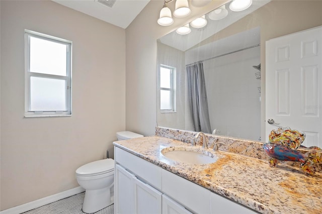 full bathroom featuring toilet, baseboards, vanity, curtained shower, and tile patterned flooring