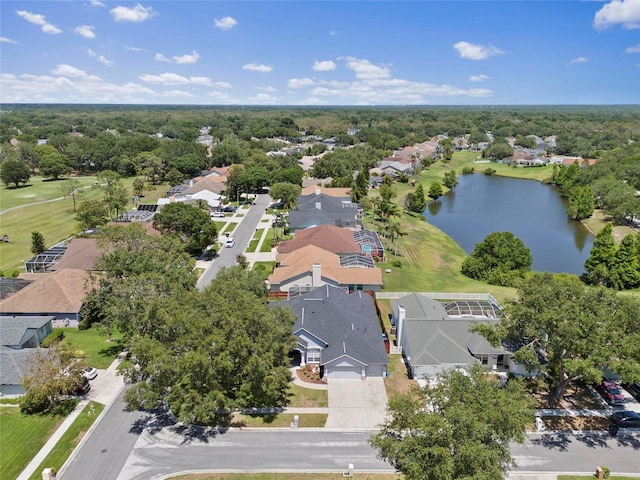 aerial view of residential area with a nearby body of water and a golf course