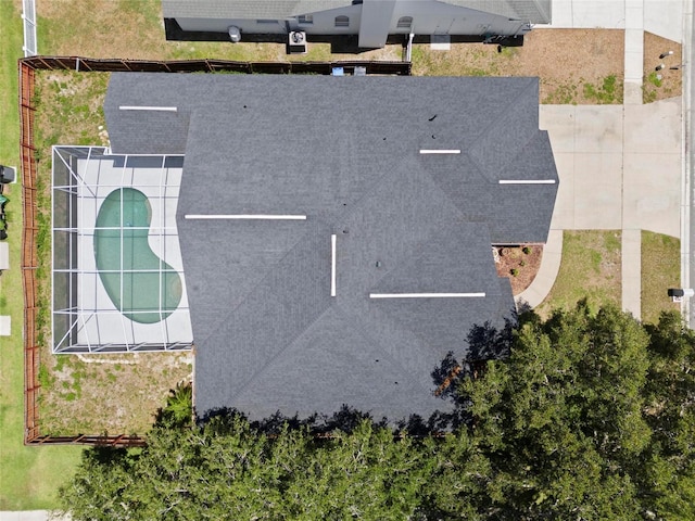 view of subject property with a pool