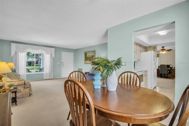 2113 Malcolm Dr, Palm Harbor, FL 34684 - dining area featuring ceiling fan, light carpet, and an office area