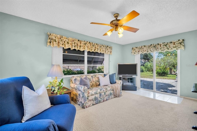 2113 Malcolm Dr, Palm Harbor, FL 34684 - carpeted living room featuring ceiling fan and a textured ceiling