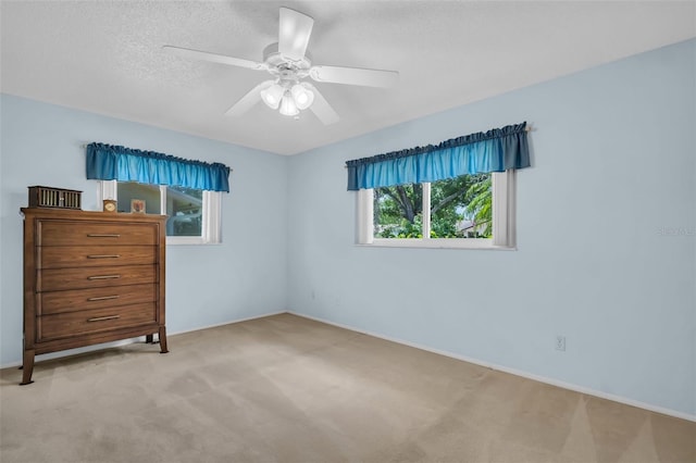 2113 Malcolm Dr, Palm Harbor, FL 34684 - carpeted bedroom featuring baseboards and ceiling fan