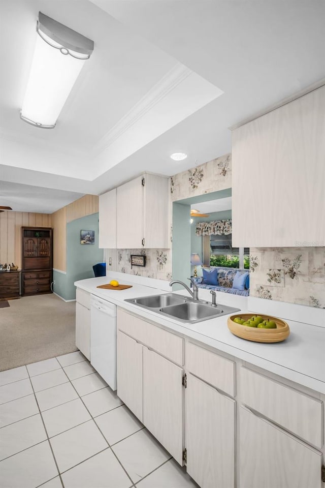 2113 Malcolm Dr, Palm Harbor, FL 34684 - kitchen with a sink, white dishwasher, light countertops, light colored carpet, and open floor plan