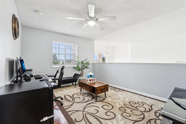 4422 Evergreen Forest Loop, Kissimmee, FL 34758 - office area featuring a textured ceiling, a ceiling fan, wood finished floors, and baseboards