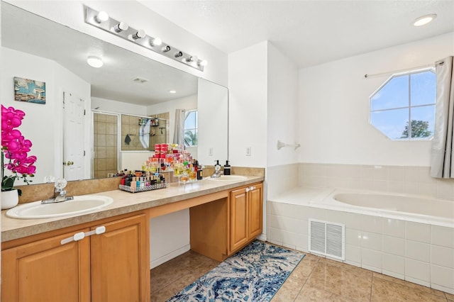 4422 Evergreen Forest Loop, Kissimmee, FL 34758 - bathroom with a shower stall, double vanity, tile patterned floors, and a bath