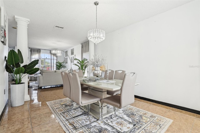 4422 Evergreen Forest Loop, Kissimmee, FL 34758 - tiled dining space with a chandelier, baseboards, and ornate columns