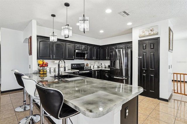 4422 Evergreen Forest Loop, Kissimmee, FL 34758 - kitchen with stainless steel fridge, black electric range oven, a peninsula, a sink, and a breakfast bar